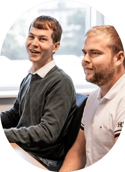 two-men-sitting-at-desk